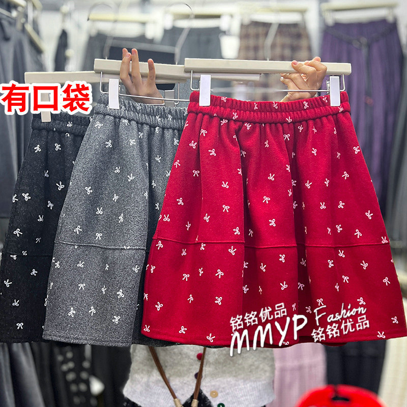秋冬圣诞氛围感蝴蝶结印花毛呢短裙半身裙女2025新款a字蓬蓬裙子