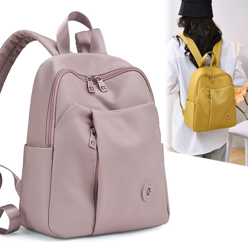 休闲简约风女士双肩包大容量轻便通勤学生书包夹层减负旅行背包