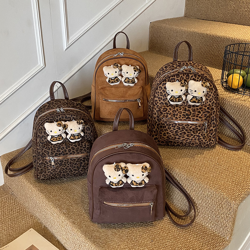 韩版外出游玩女孩大容量可爱卡通公仔豹纹双肩包女童宝宝简约书包