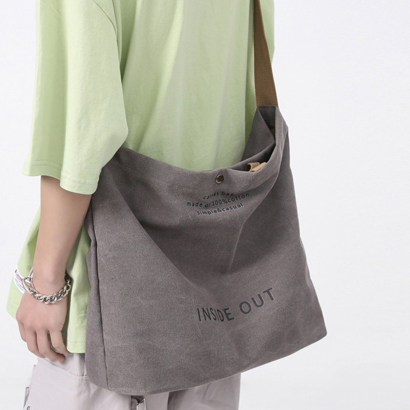 潮流男生休闲大容量单肩包个性字母手提包袋上课包复古帆布斜挎包