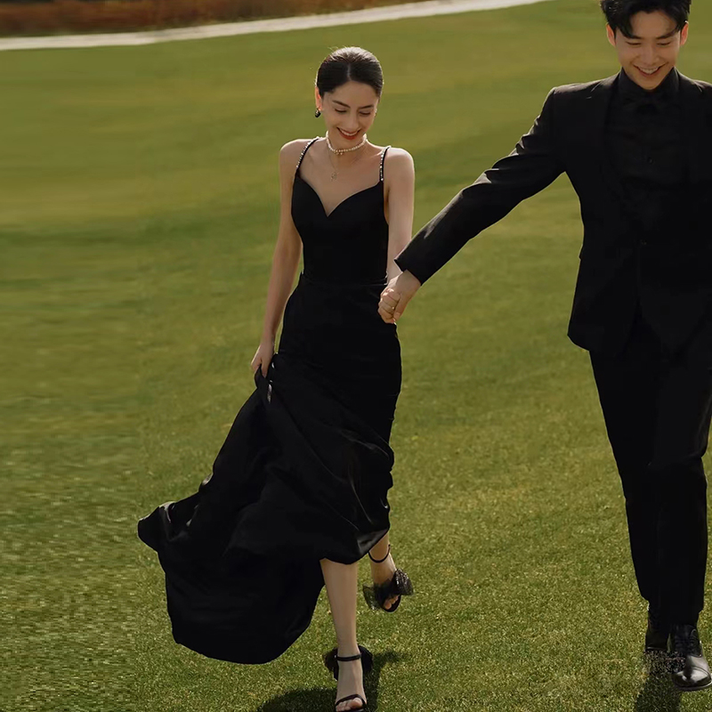 影楼黑色吊带外景婚纱晚礼服露背高级感年会聚会主持鱼尾缎布礼服