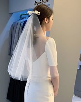 New bride's head dress with small head dress and bow tie