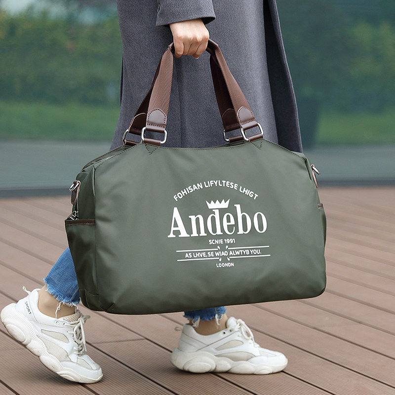超大容量旅行包2021新款潮女手提男士短途健身出差轻便帆布行李袋