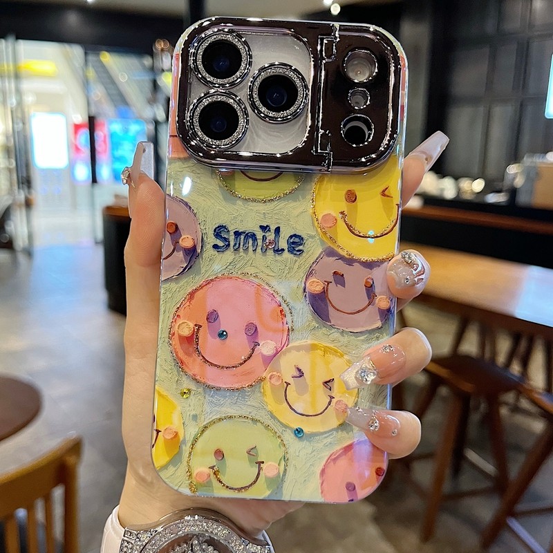 适用苹果系列iPhone17新款手机壳15pro13promax搞怪Smile笑脸14pro16promax枪色精孔镜框支架ins风女款保护套