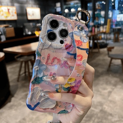 适用苹果系列iPhone16网红手机壳15promax扭扭边小众蓝光腕带支架小清新甜美love防摔14/13/12透气新款保护套