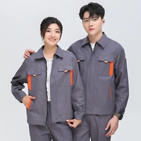 Темно -серого апельсинового костюма