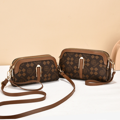 广州狮岭包包女士2025春秋新款时尚大容量白沟百搭简约软皮手机包