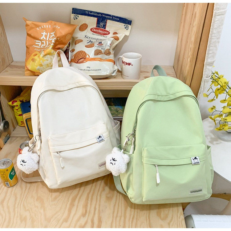 简约书包女新款大学生日系旅行双肩包韩版纯色初中小学生休闲背包