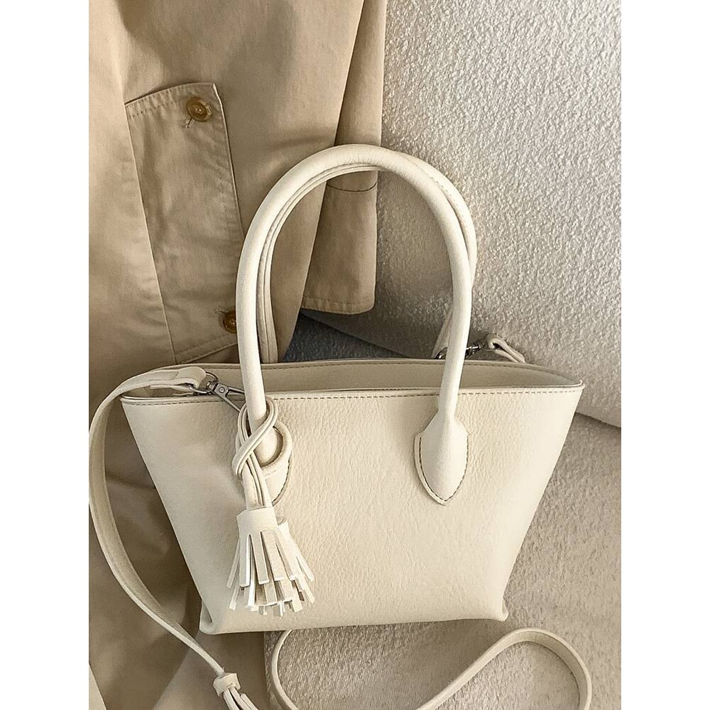 官方正品韩国简约ins风流苏水桶包女2026春季新款时尚小众手提菜