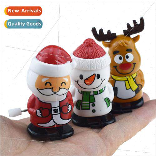 Cute wind-up clockwork santa bobbing head walking snowman to