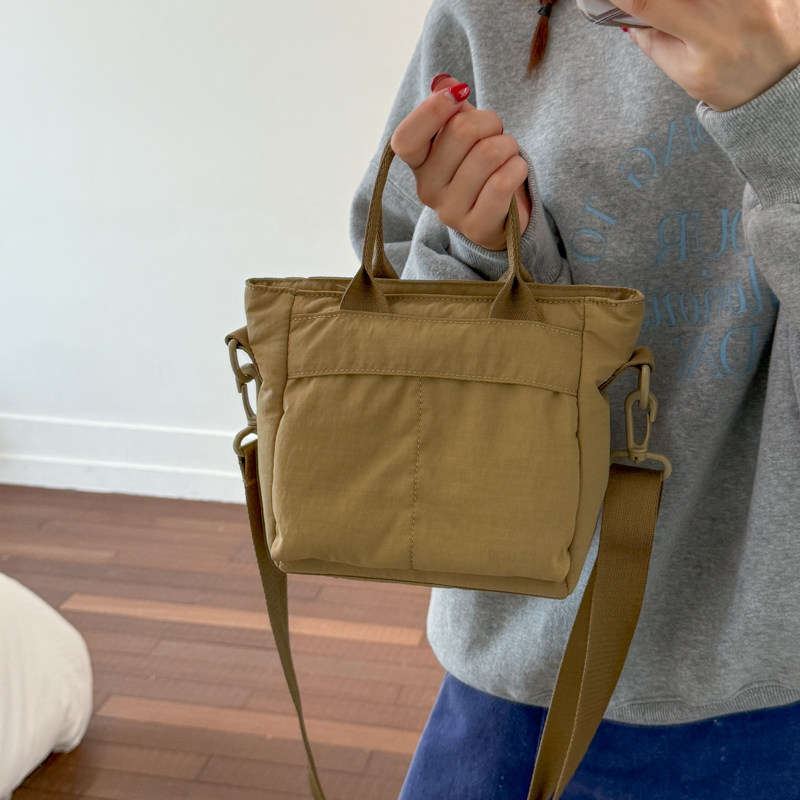 帆布包包2026新款日系女休闲百搭挎包两用单肩手提包多口袋斜挎包