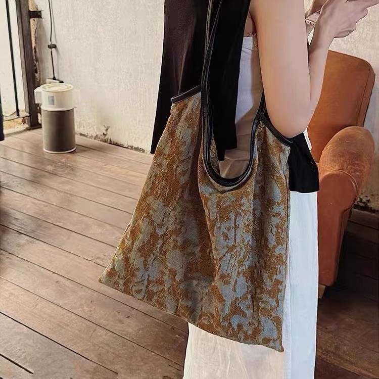 原创设计油画包软皮帆布托特包2025新款轻奢大容量手提通勤单肩包