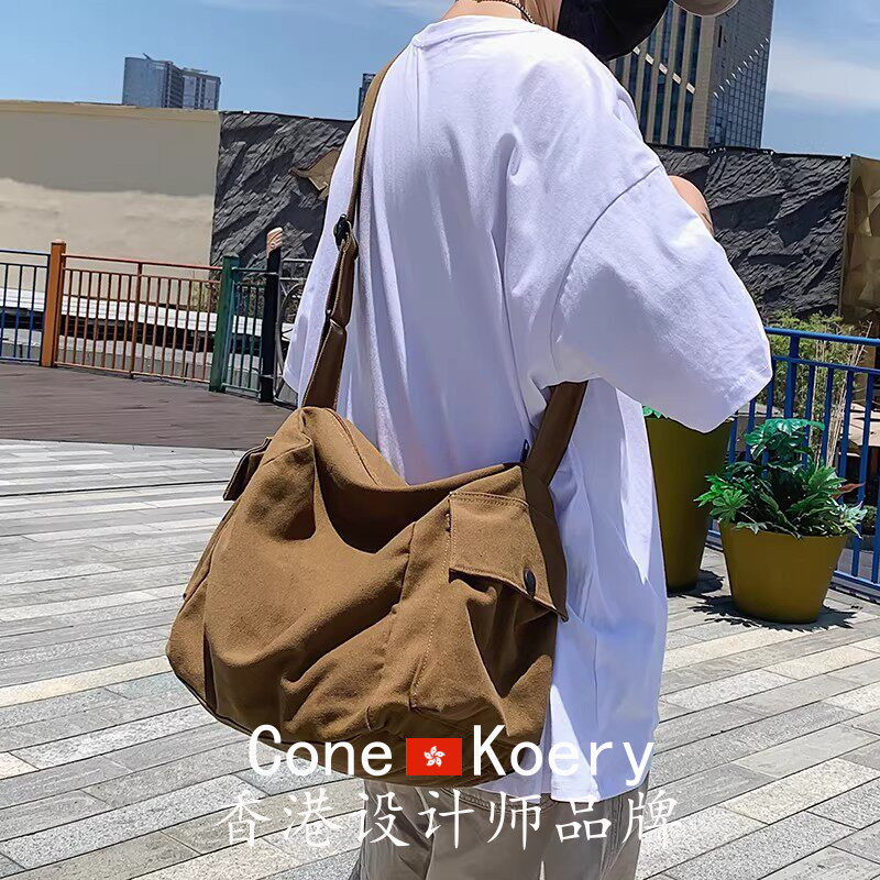 法国复古帆布包男生休闲大容量斜挎包ins潮牌单肩包女通勤邮差包