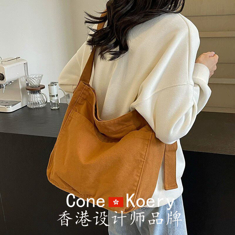 法国帆布包斜挎女大容量2026新款松弛休闲邮差包宽肩带通勤高级感