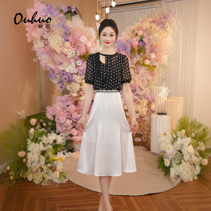 减龄气场强大连衣裙女2025夏季不规则黑色波点收腰裙子OHDRI06077