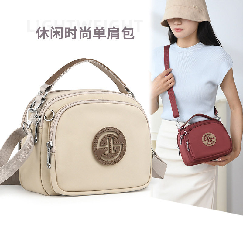 日本牛津布斜背包女手拎小包
