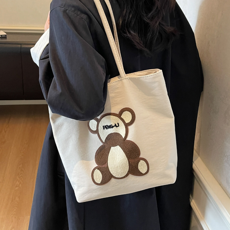 卡通小熊帆布包包女2025新款夏季通勤托特包大容量学生上课单肩包