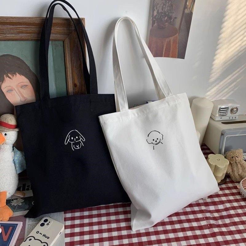 原创简约纯色黑白调单肩包包女棉学生书韩版休闲文艺大容量帆布包