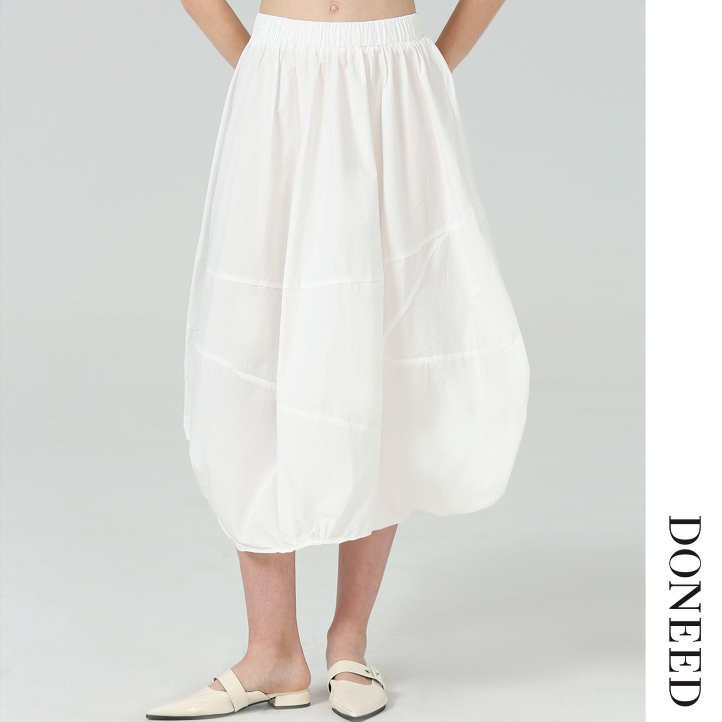 DONEED2025夏款时尚简约不对称设计感解构花苞松紧纯棉半身裙女