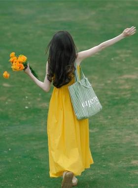 云南大理洱海新疆海边度假旅游穿搭拍照巨好看黄色吊带连衣裙女夏