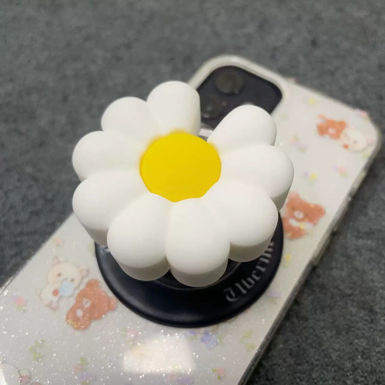 清新雏菊造型软胶手机支架哑光黑底英文印刷通勤自拍便携伸缩背贴
