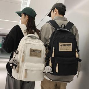 大容量女士双肩包女高级感黑色白色书包简约初中高中大学生背包男