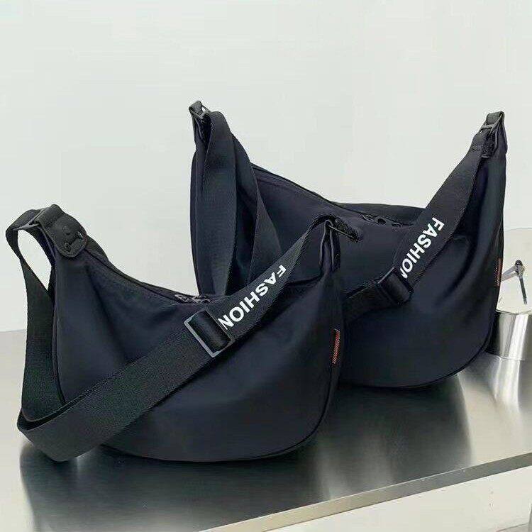 法国MKDN~女包2026新款通勤斜挎饺子包休闲大容量牛津布单肩包女*