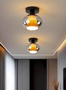 The hallway lights are closed to the doorway. The glass is l