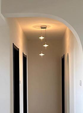 A narrow staircase chandelier at the New Star Rains Suite.