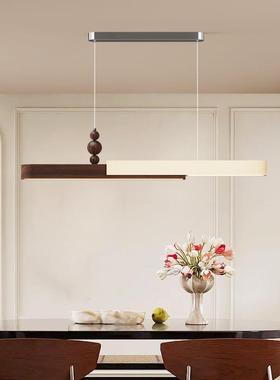 An ancient table in the French Creams chandelier.