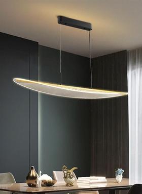 The designers chandeliers are modern, condensed dining room