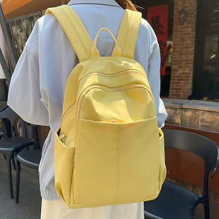 中点纯色简约书包女大学生小众高级感2025新款 双肩包女大容量背包