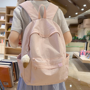 中点纯色书包女大学生初中高中生休闲简约背包轻便防水旅行双肩包