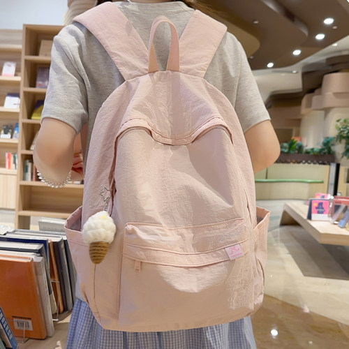 纯色书包休闲背包轻便防水双肩包