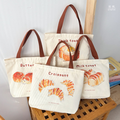 日系卡通可爱面包猫咪帆布袋手提包通勤购物袋烘焙店logo定制