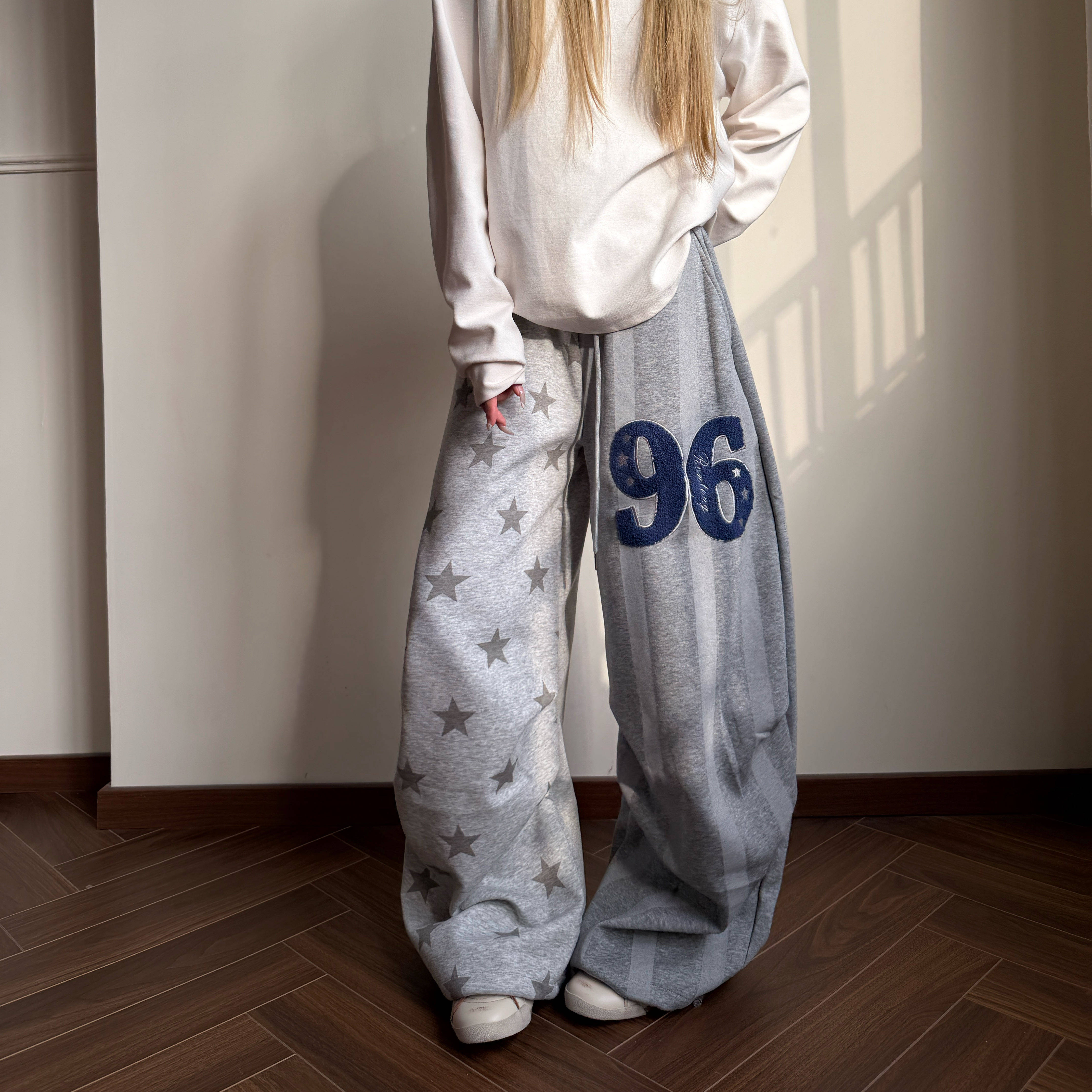 Amoeba美式复古撞色星星拼接条纹不对称宽松阔腿褶皱弯刀长裤卫裤