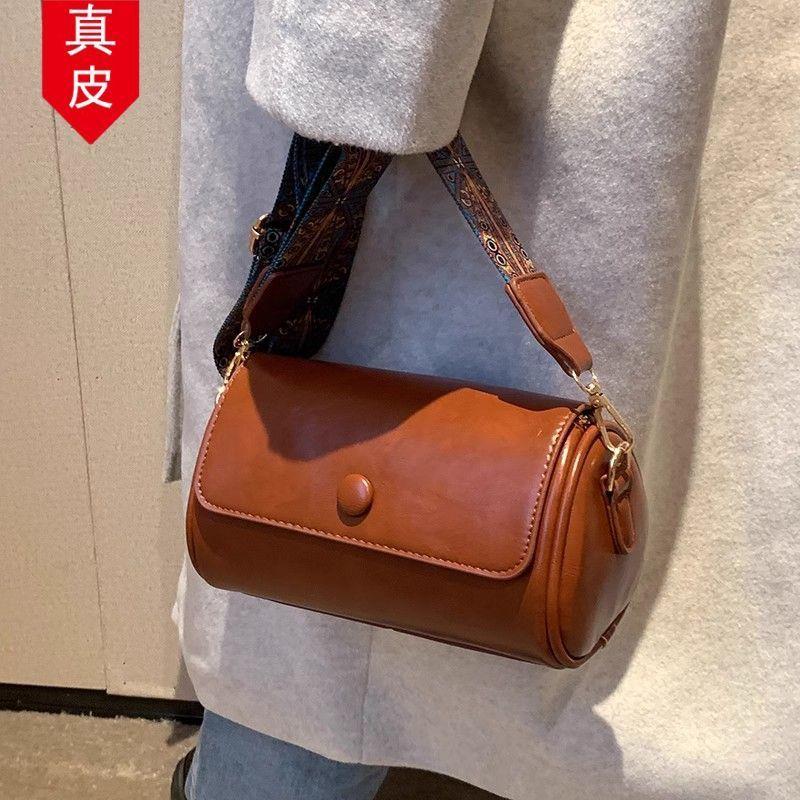 挎圆筒斜新款女包包包百搭时尚圆柱形2026轻奢斜挎包宽带单肩真皮