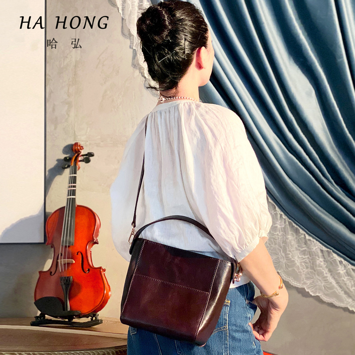 哈弘 头层牛皮秋冬新款大容量休闲小众设计复古高级斜挎包水桶包