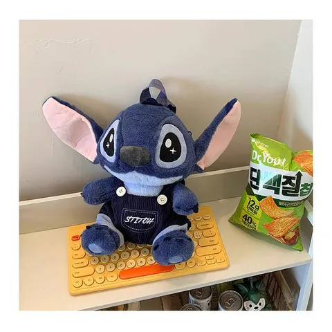 新款秋娃娃机公仔双肩背包搞怪礼物背带裤网红史迪仔毛绒玩具