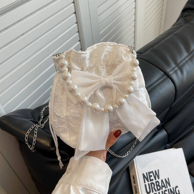 新品 珍珠包包女2025外贸新款时尚甜美蝴蝶结链条水桶包小众百搭,箱包皮具/热销女包/男包,水桶包,淘宝优惠券,粉丝福利购,淘宝优惠卷