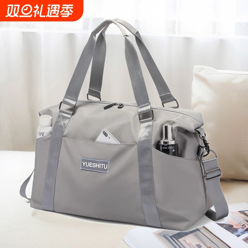 大容量手提短途旅行包女时尚轻便防水行李包男出差旅游收纳登机包