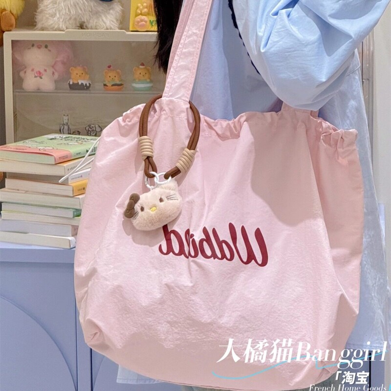 大橘猫春夏轻薄松弛感托特包女2026新款抽绳帆布包通勤手提大容量