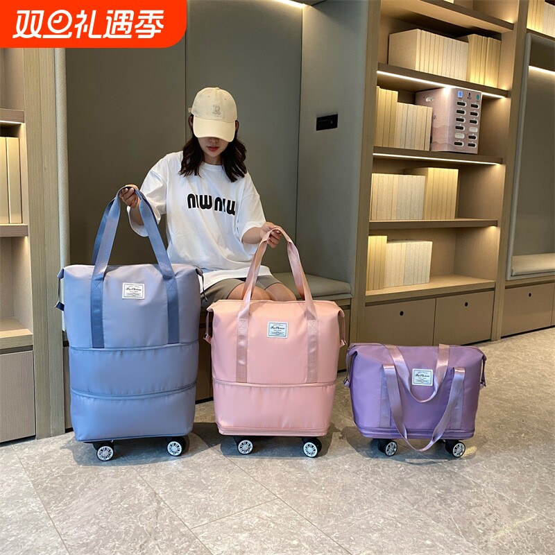 旅行包万向轮新款出差便携手拉行李袋带滑轮收纳包大容量健身包