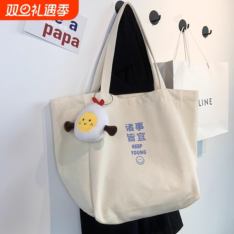 原创设计通勤大容量单肩帆布包女夏季新款学生ins文艺手提书包袋