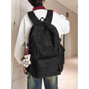 金玉鸟减负护脊初中生书包男学生轻便高中女孩双肩包黑色绿色红色