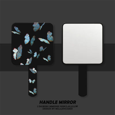 满屏蓝色蝴蝶手柄镜子便