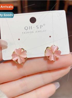 Cat eye stone four-leaf flower rotating earrings 2023 new ni