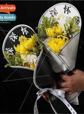 deep remembrance flowers wrapped in kraft paper rual grave s