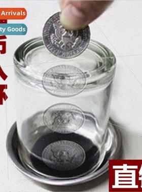 coin into cup coins through cup coasters close-up children m