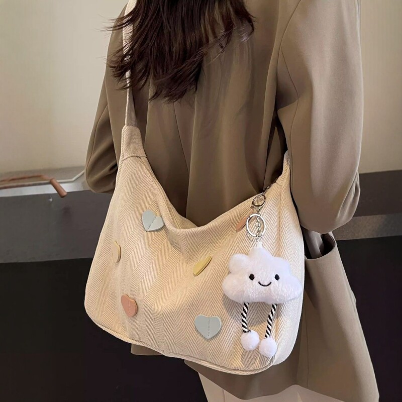 韩版ins百搭帆布包女通勤腋下单肩包休闲饺子包大学生上课斜挎包